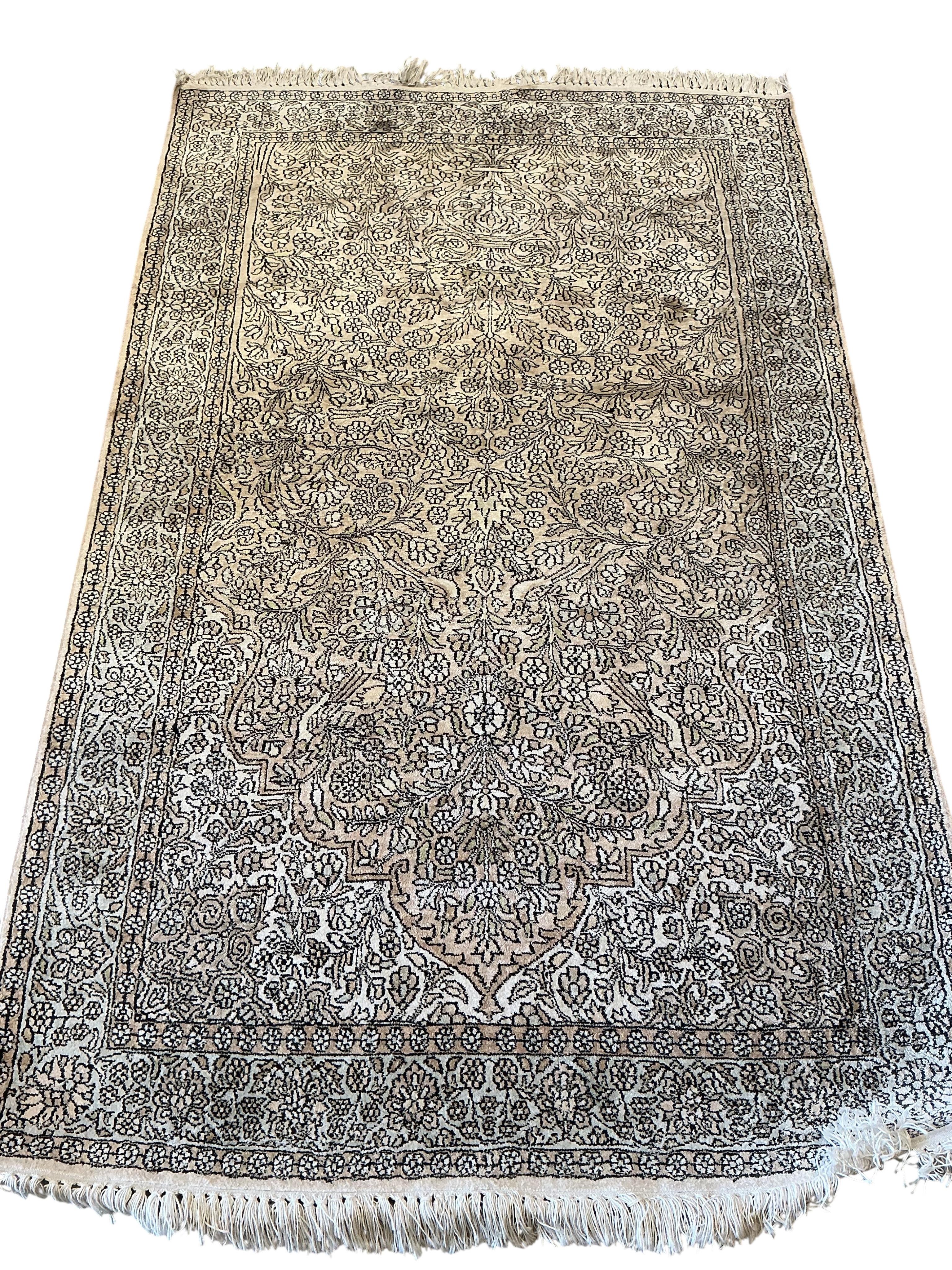 A North West Persian faded red ground rug, 191 x 120cm